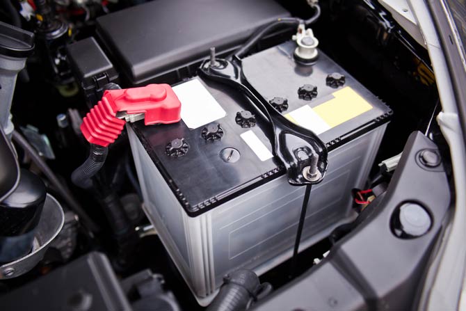 Battery holder in the engine compartment